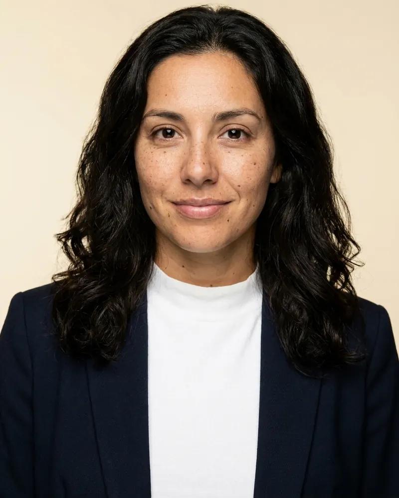 Navy blazer on a cream backdrop