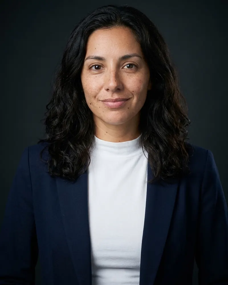 Navy blazer on a charcoal backdrop