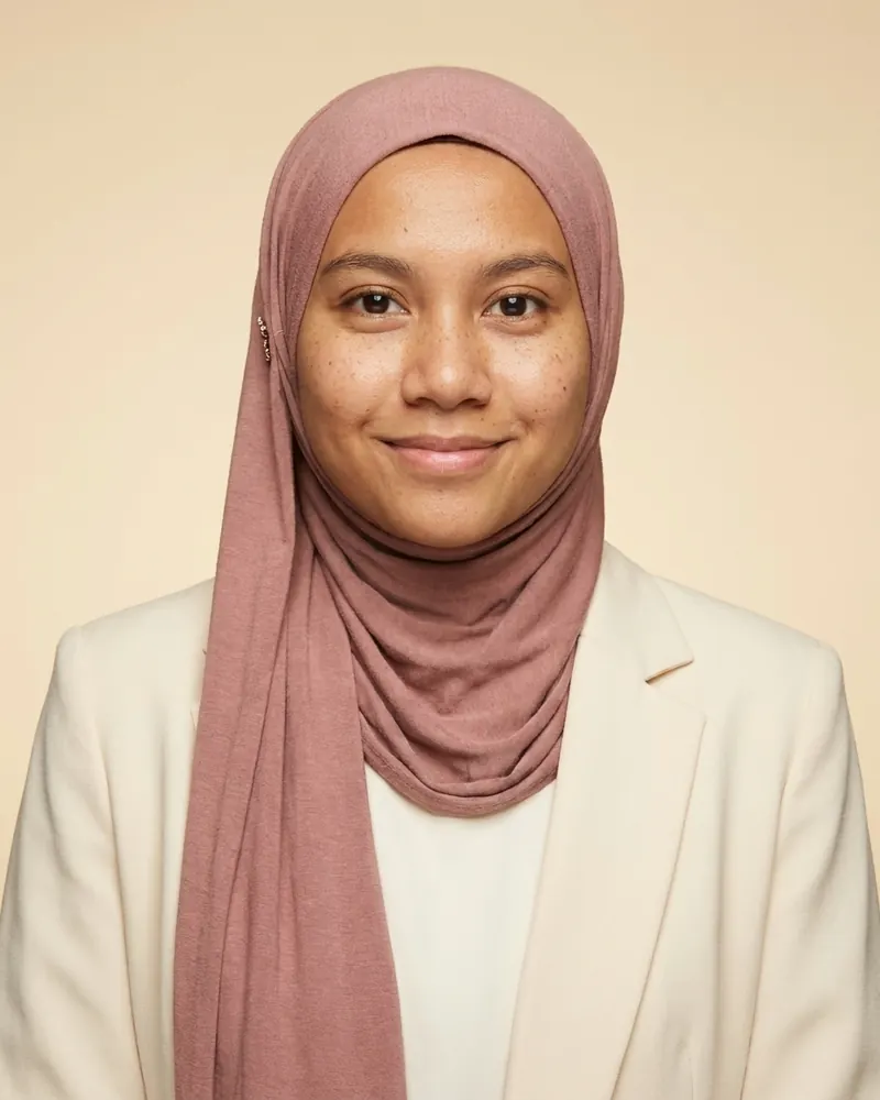 Soft studio look with a dusty rose hijab and cream blazer